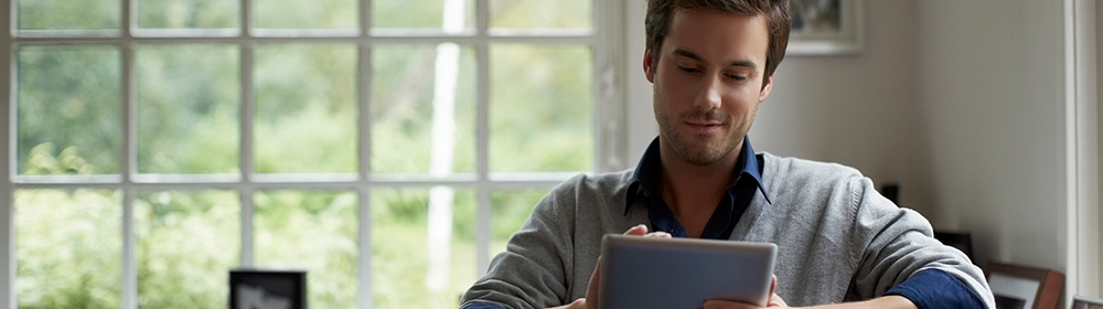 Man looking at digital tablet