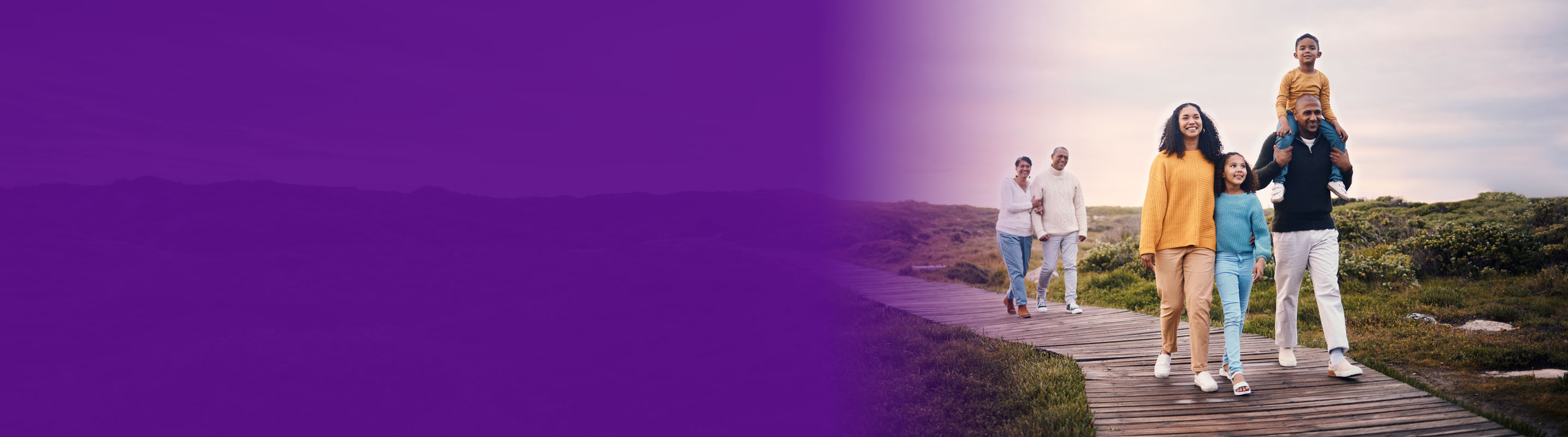family walking on a hike path