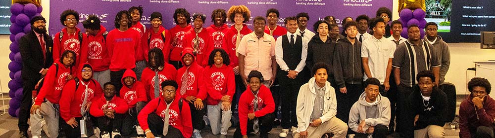 Students pose for a photo at the Defying the Odds event.