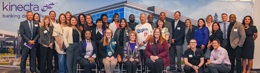 Group of credit union and community partners pose for a picture.