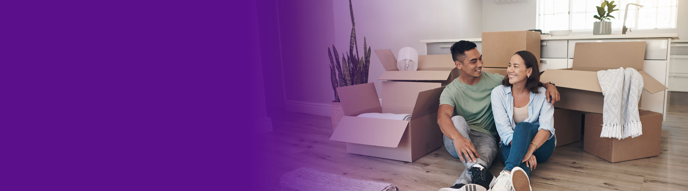 couple and a dog moving into their home