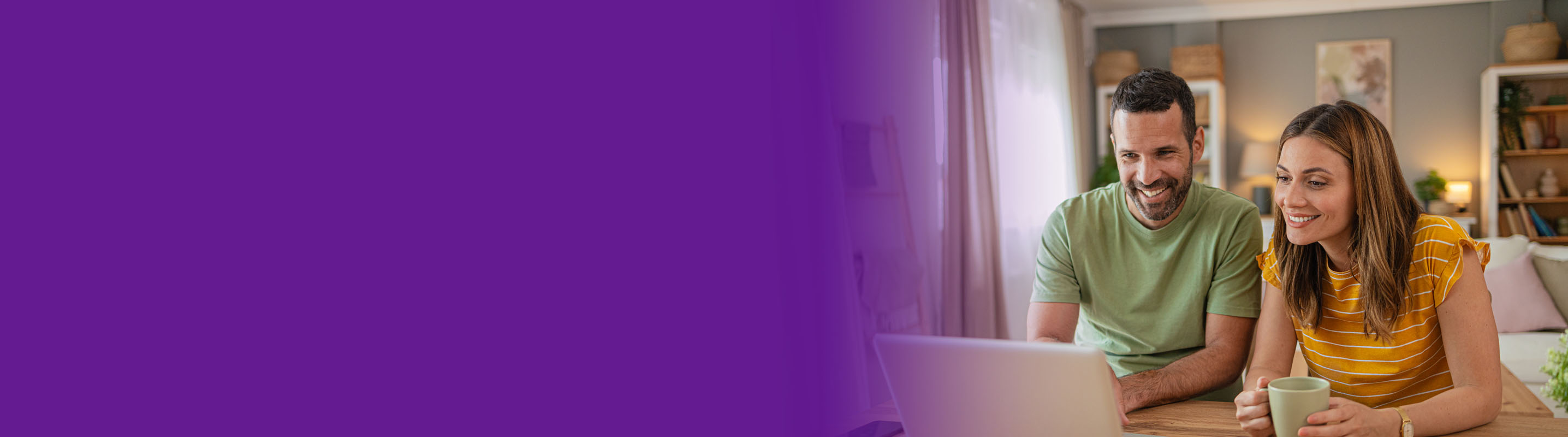 couple looking at stories on a laptop